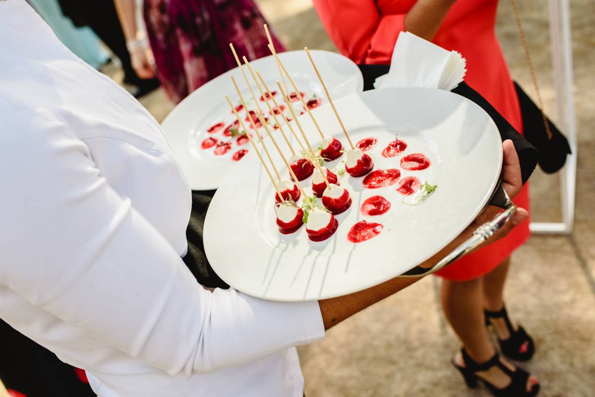 Waiter serving snacks during a wedding.