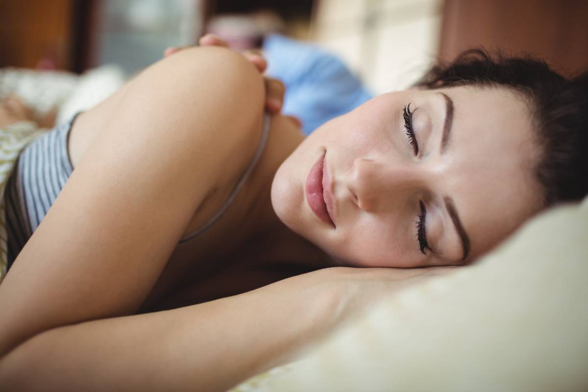 Romantic couple sleeping on bed