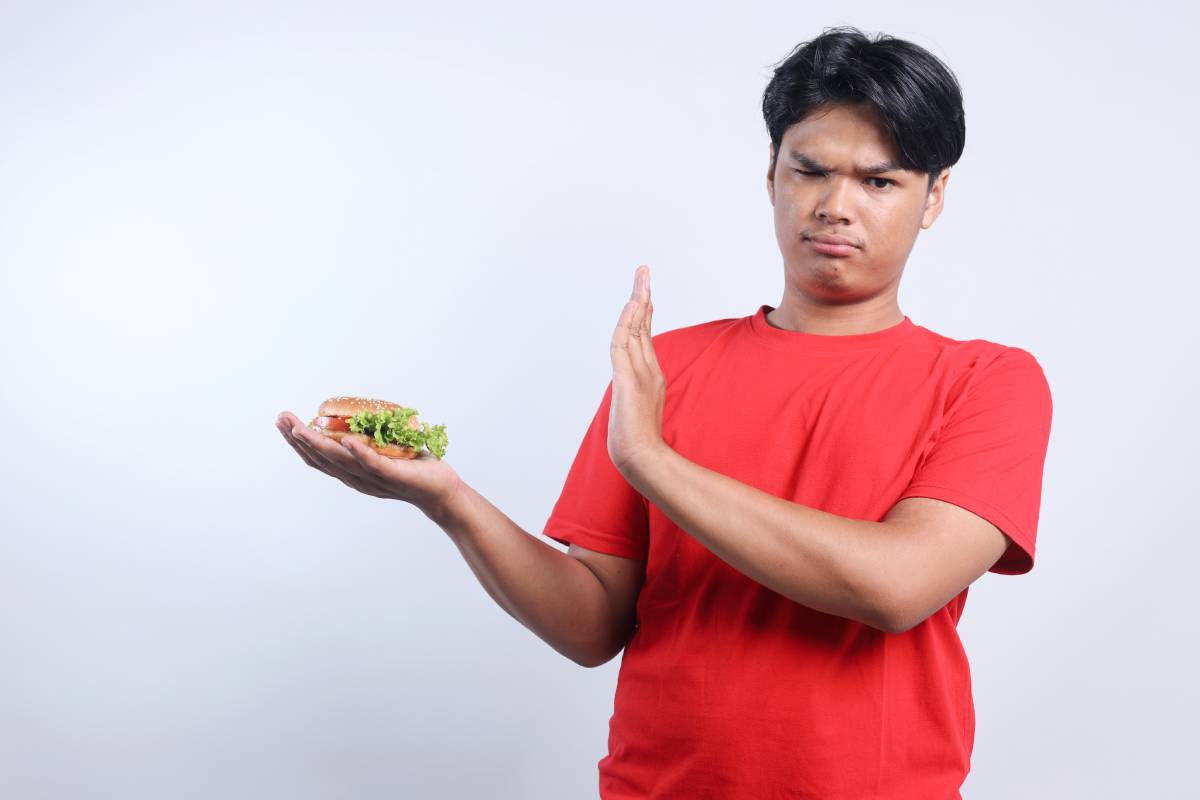 funny-young-man-refusing-to-eat-unhealthy-food-2025-03-15-17-04-00-utc (1)